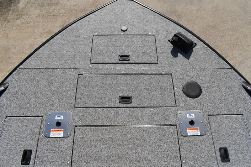 Slide: The Image of 2026 Lowe Sport Deck 224 boat deck with storage compartments and fixtures. - 15