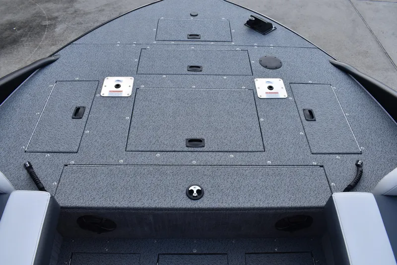 Slide: The Image of 2026 Lowe Sport Deck 224 boat deck with storage compartments and seating. - 18