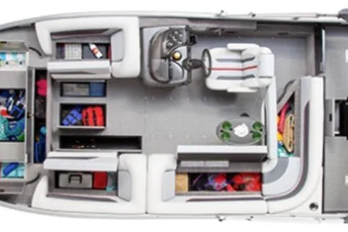 Slide: The Image of 2026 Lowe Sport Deck 224 boat with canopy on trailer, parked outdoors. - 2