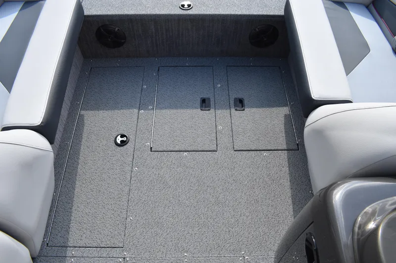 Slide: The Image of 2026 Lowe Sport Deck 224 interior with gray carpet and seating. - 23