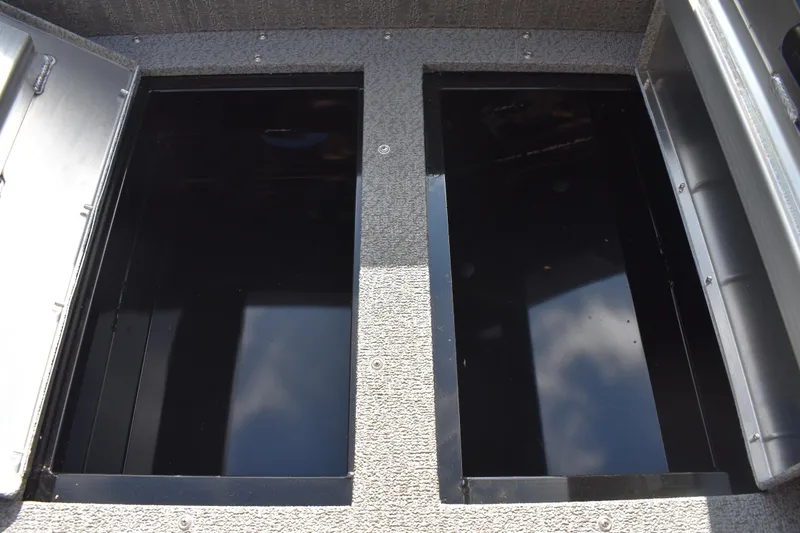 Slide: The Image of Open storage compartments on a 2026 Lowe Sport Deck 224 boat. - 27