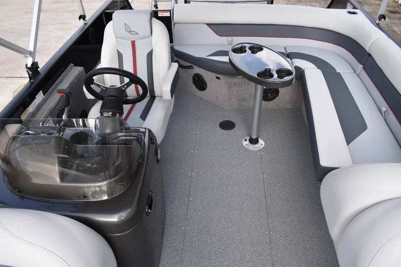 Slide: The Image of 2026 Lowe Sport Deck 224 interior with steering console and seating area. - 33