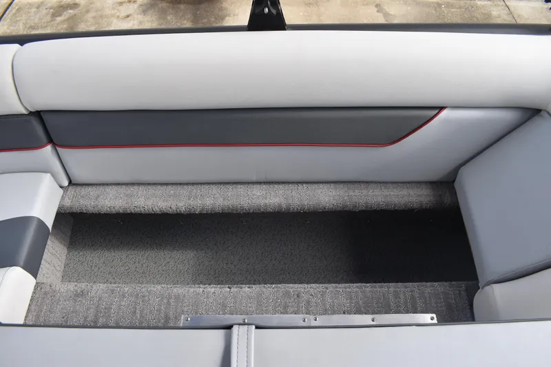 Slide: The Image of 2026 Lowe Sport Deck 224 boat interior seating with gray and white upholstery. - 39