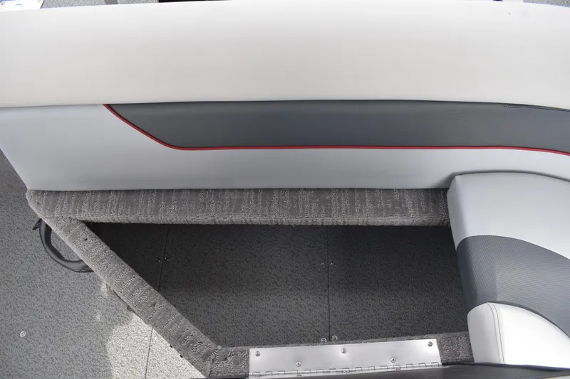 Slide: The Image of 2026 Lowe Sport Deck 224 interior seating with gray and white upholstery, featuring red accents. - 40