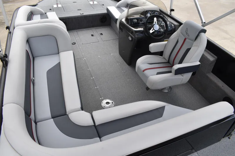 Slide: The Image of 2026 Lowe Sport Deck 224 interior with modern seating and steering console. - 42