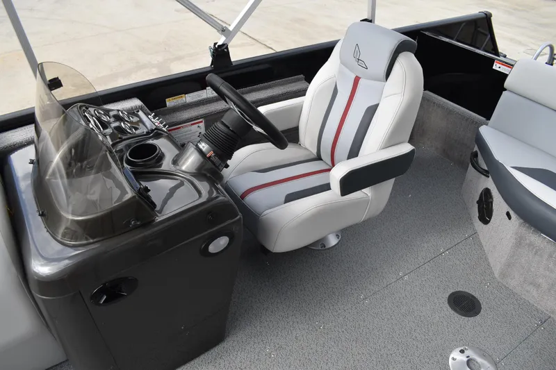 Slide: The Image of 2026 Lowe Sport Deck 224 boat interior with steering console and captain's chair. - 44