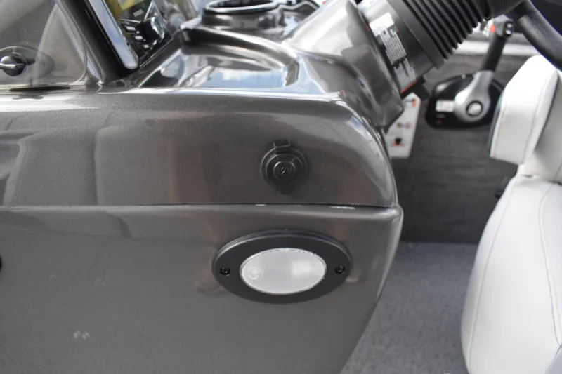 Slide: The Image of 2026 Lowe Sport Deck 224 dashboard with steering wheel and control panel. - 46