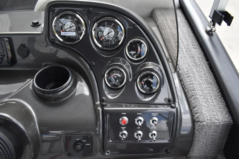 Slide: The Image of Dashboard of 2026 Lowe Sport Deck 224 boat with gauges and controls. - 51