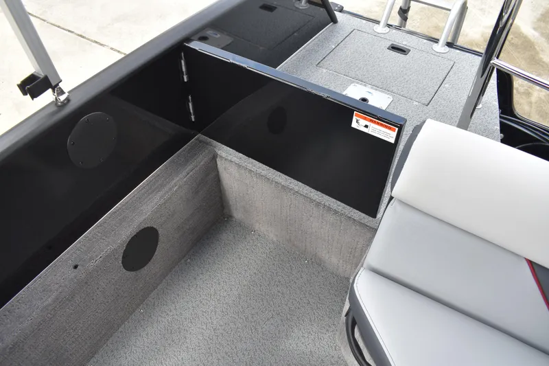 Slide: The Image of 2026 Lowe Sport Deck 224 boat interior with storage compartment and seating. - 53