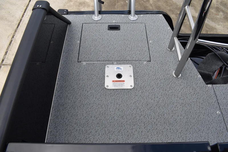 Slide: The Image of 2026 Lowe Sport Deck 224 boat deck with ladder and textured surface. - 54