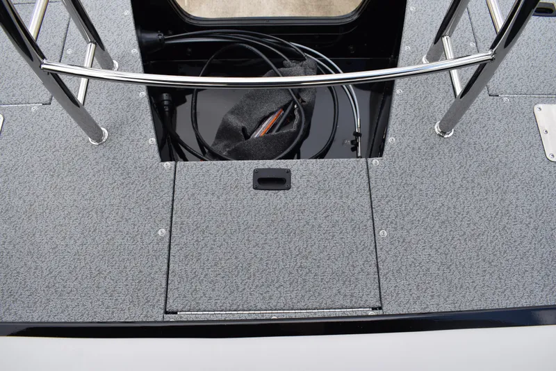 Slide: The Image of 2026 Lowe Sport Deck 224 boat deck with storage compartment and railing. - 55