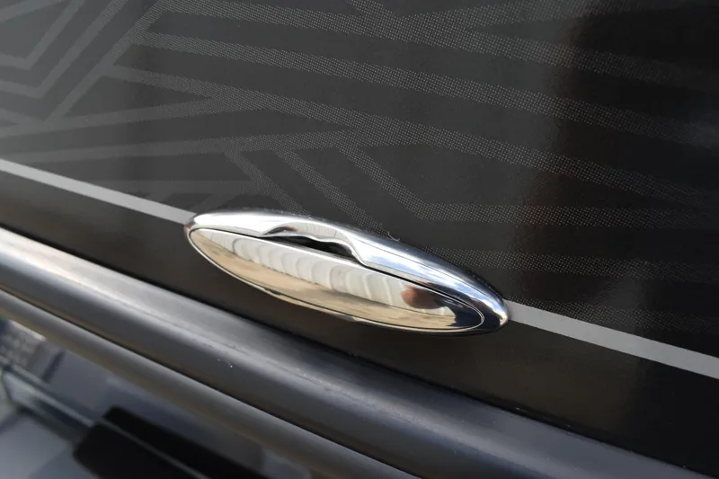 Slide: The Image of Chrome handle on 2026 Lowe Sport Deck 224 boat with sleek black design. - 61