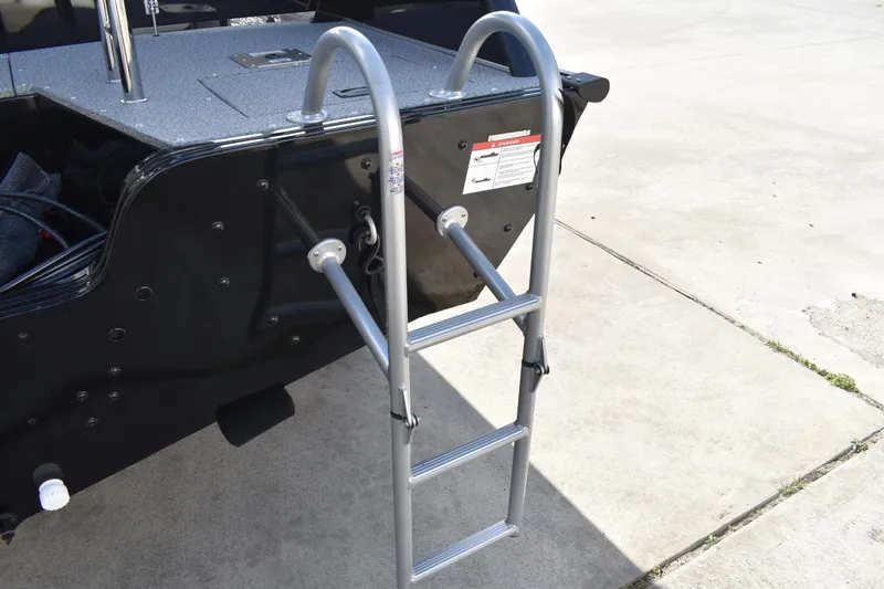 Slide: The Image of Lowe Sport Deck 224 (2026) boat ladder on concrete surface. - 8