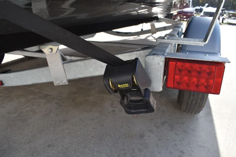 Slide: The Image of Trailer hitch and taillight of 2026 Lowe Sport Deck 224 boat. - 9