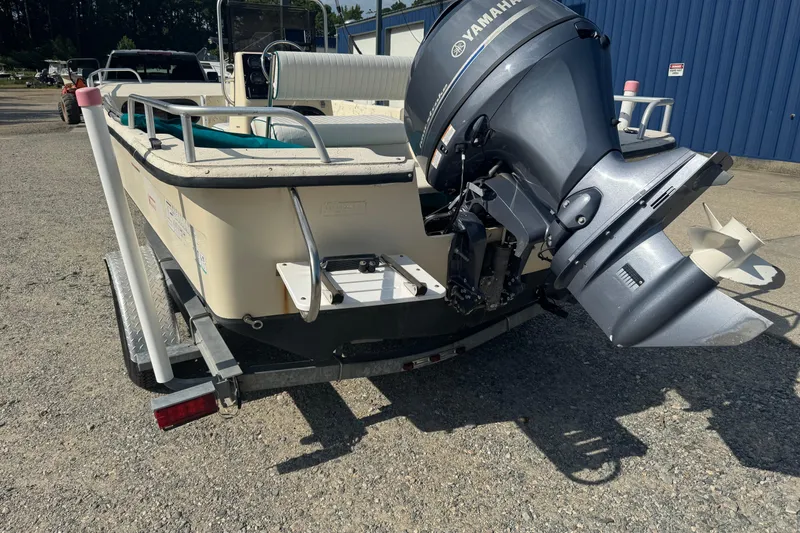 Slide: The Image of 2000 Carolina Skiff Semi-V 1980 boat with Yamaha outboard motor on trailer. - 4