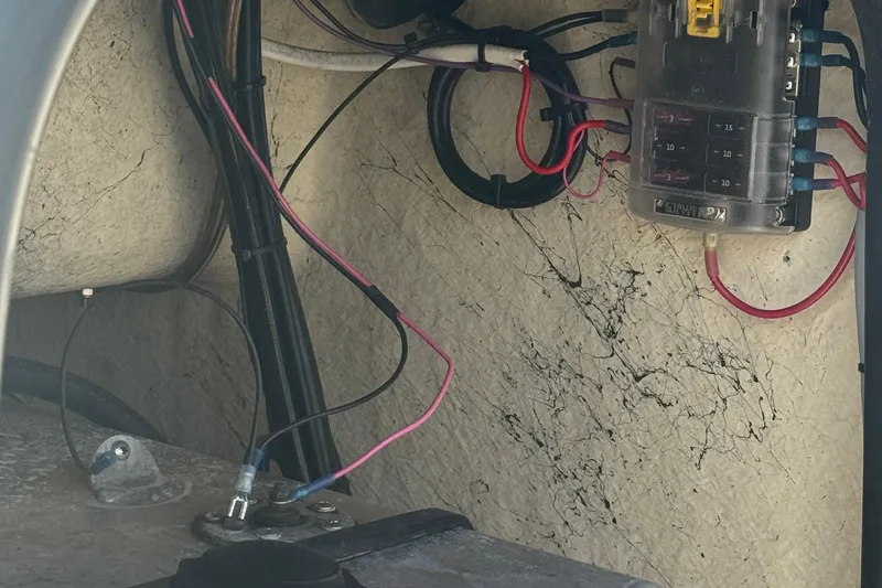 Slide: The Image of Electrical wiring and fuse box inside a 2000 Carolina Skiff Semi-V 1980 boat. - 9