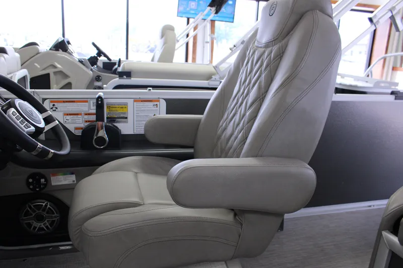 Slide: The Image of Luxurious captain's chair in 2022 Premier Intrigue 230 Bed boat interior. - 19