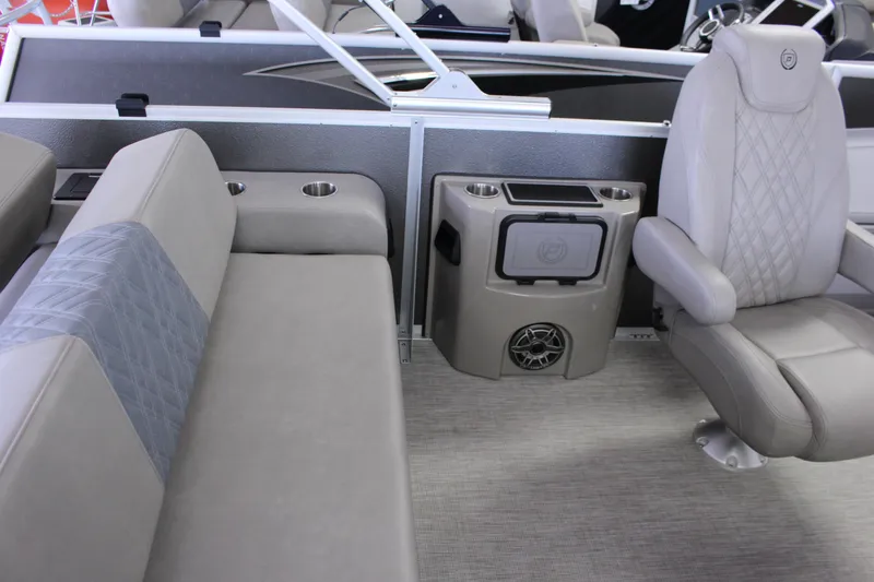 Slide: The Image of Interior of 2022 Premier Intrigue 230 Bed pontoon boat with plush seating and cup holders. - 7