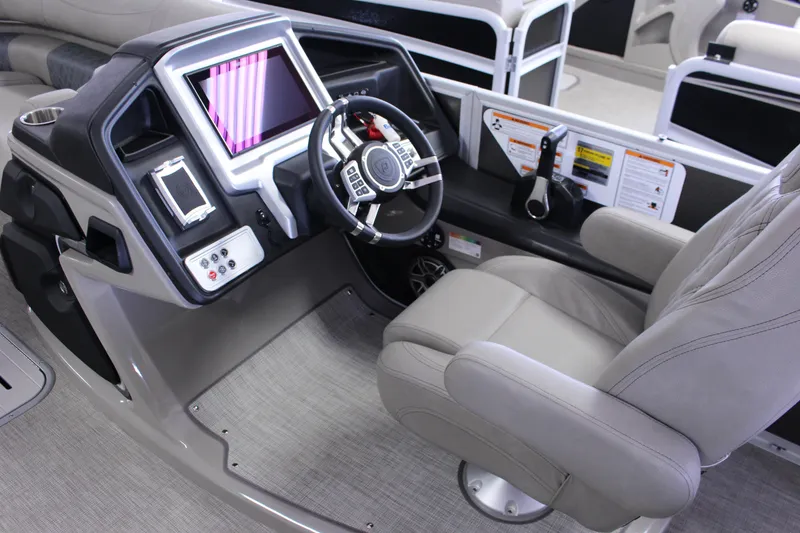Slide: The Image of Luxurious 2022 Premier Intrigue 230 Bed boat cockpit with modern steering and controls. - 8