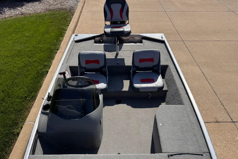 Slide: The Image of 2013 Tracker Pro165 boat interior with seating and steering console. - 4
