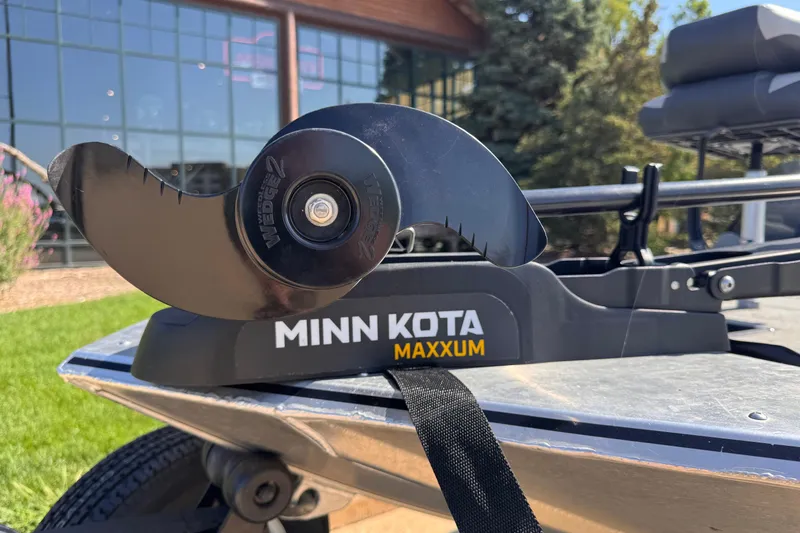 Slide: The Image of Minn Kota Maxxum motor on 2013 Tracker Pro165 boat, outdoor setting. - 6