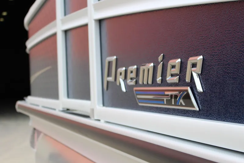 Slide: The Image of Close-up of 2022 Premier Sunsation 230 boat logo on textured surface. - 11