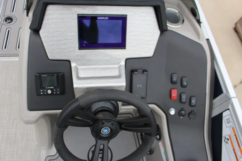 Slide: The Image of 2022 Premier Sunsation 230 dashboard with steering wheel and control panel. - 4