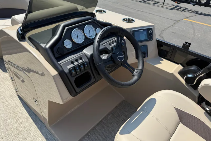 Slide: The Image of 2026 Bentley Pontoons Legacy 200 Navigator dashboard with steering wheel and control panel. - 14