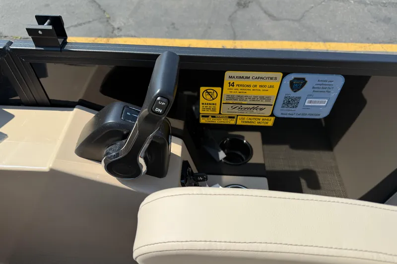Slide: The Image of Control panel of 2026 Bentley Pontoons Legacy 200 Navigator with capacity warning label. - 17