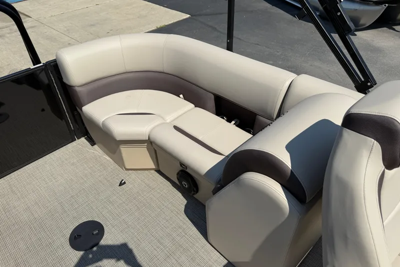 Slide: The Image of 2026 Bentley Pontoons Legacy 200 Navigator interior with beige and brown seating. - 19