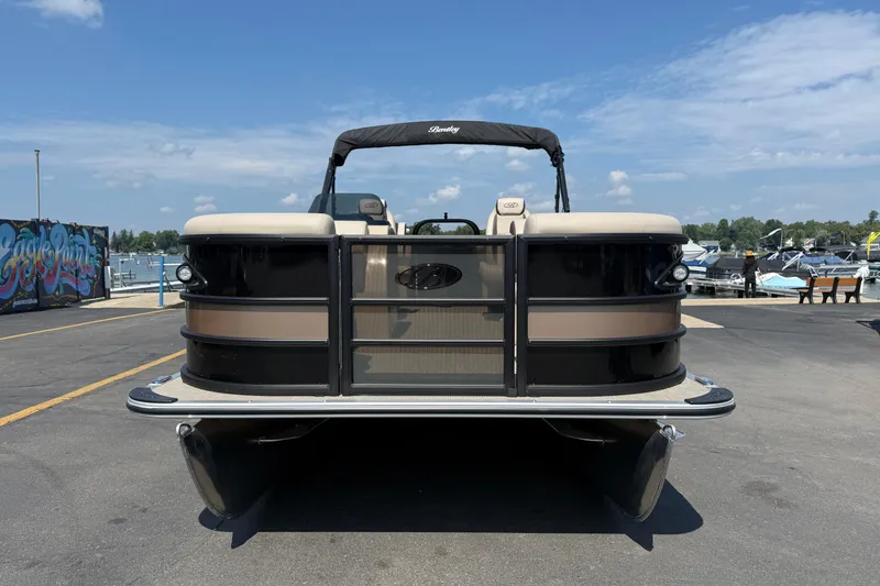 Slide: The Image of 2026 Bentley Pontoons Legacy 200 Navigator at marina, showcasing sleek design and modern features. - 2