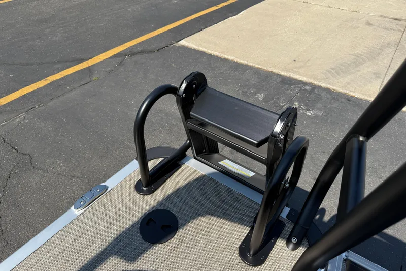 Slide: The Image of 2026 Bentley Pontoons Legacy 200 Navigator boat ladder on textured deck surface. - 21