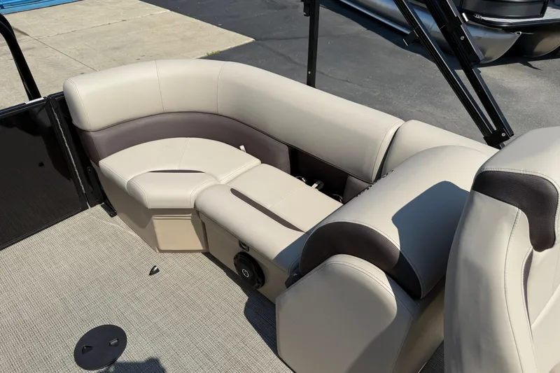 Slide: The Image of 2026 Bentley Pontoons Legacy 200 Navigator interior seating, featuring beige and brown upholstery. - 25