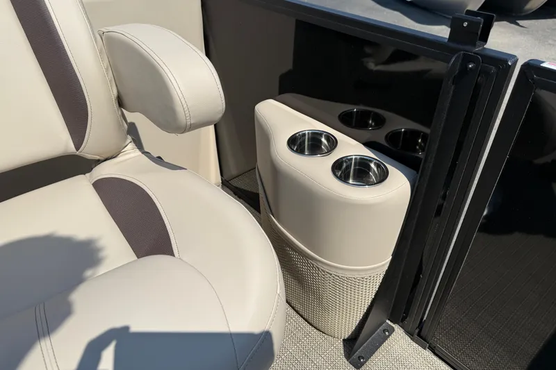 Slide: The Image of 2026 Bentley Pontoons Legacy 200 Navigator interior with beige seating and cup holders. - 26