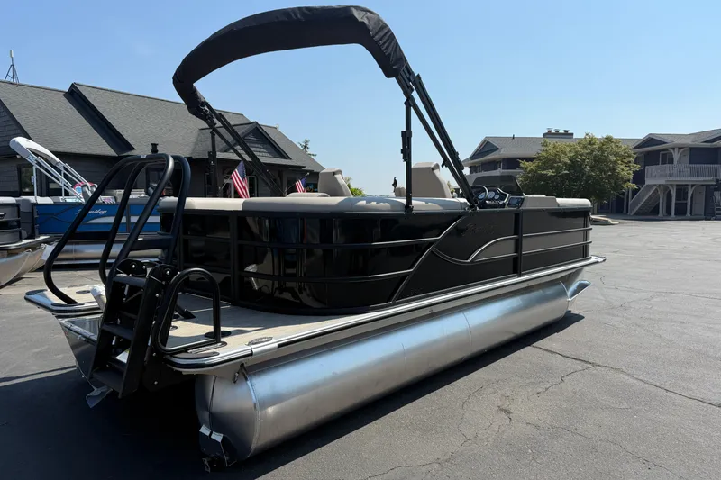 Slide: The Image of 2026 Bentley Pontoons Legacy 200 Navigator, sleek design, parked outdoors on a sunny day. - 3