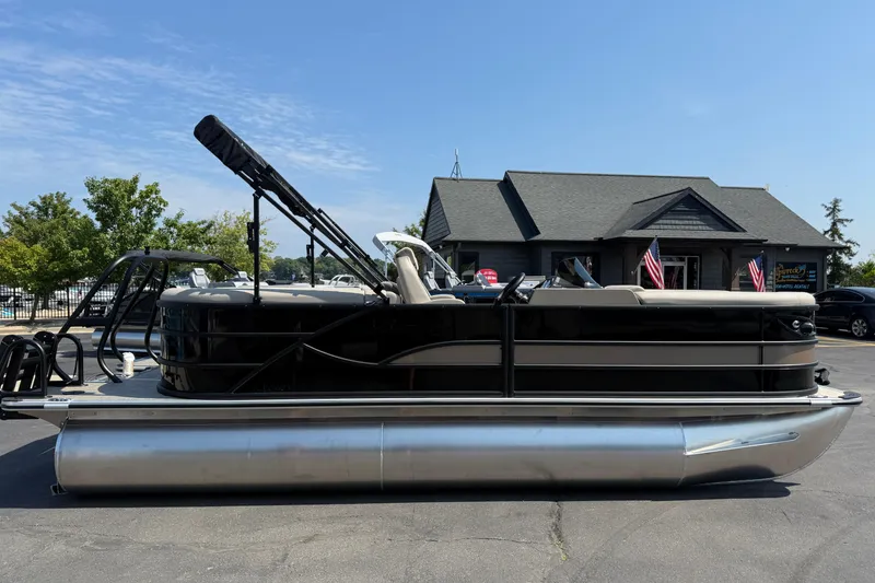 Slide: The Image of 2026 Bentley Pontoons Legacy 200 Navigator, sleek design, parked outdoors, dealership background. - 4