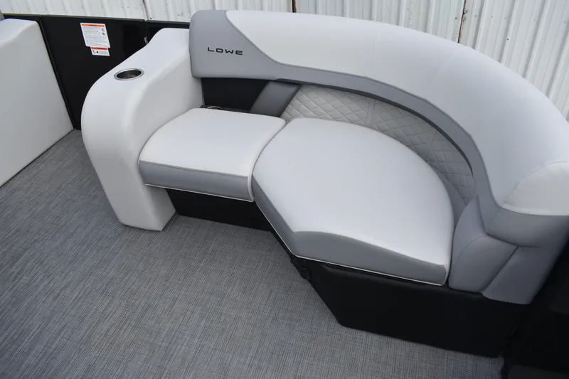 Slide: The Image of 2026 Lowe SS 210 boat interior with stylish gray seating and cup holder. - 10