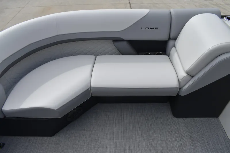 Slide: The Image of Luxurious seating on 2026 Lowe SS 210 boat, featuring sleek gray upholstery. - 11