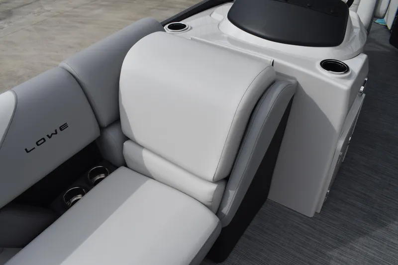 Slide: The Image of 2026 Lowe SS 210 boat interior with gray seating and cup holders. - 12