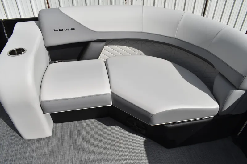 Slide: The Image of 2026 Lowe SS 210 boat interior with gray cushioned seating and cup holder. - 14