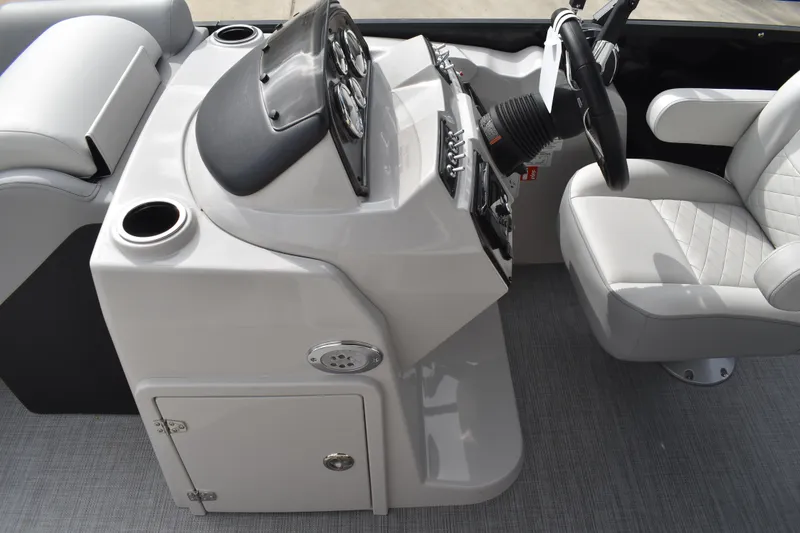 Slide: The Image of 2026 Lowe SS 210 boat interior with steering console and cushioned seating. - 21