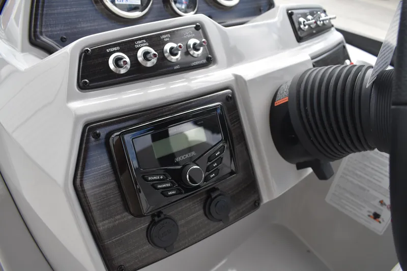 Slide: The Image of Control panel of 2026 Lowe SS 210 boat with stereo and switches. - 23