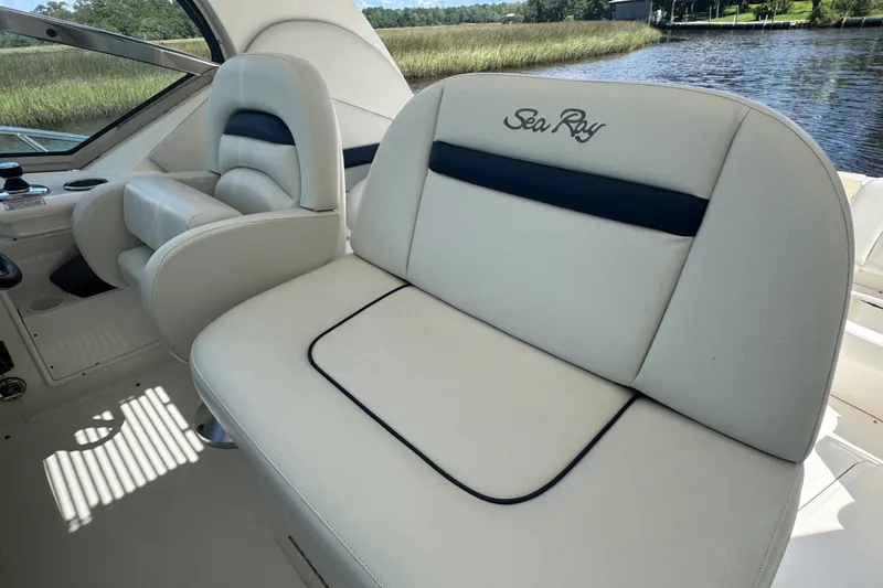 Slide: The Image of Luxury seating on 2010 Sea Ray 390 Sundancer boat, featuring elegant white upholstery. - 13
