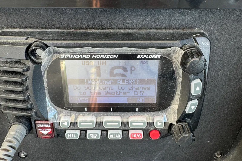 Slide: The Image of Marine radio displaying weather alert on Sea Ray 390 Sundancer, 2010 model. - 21