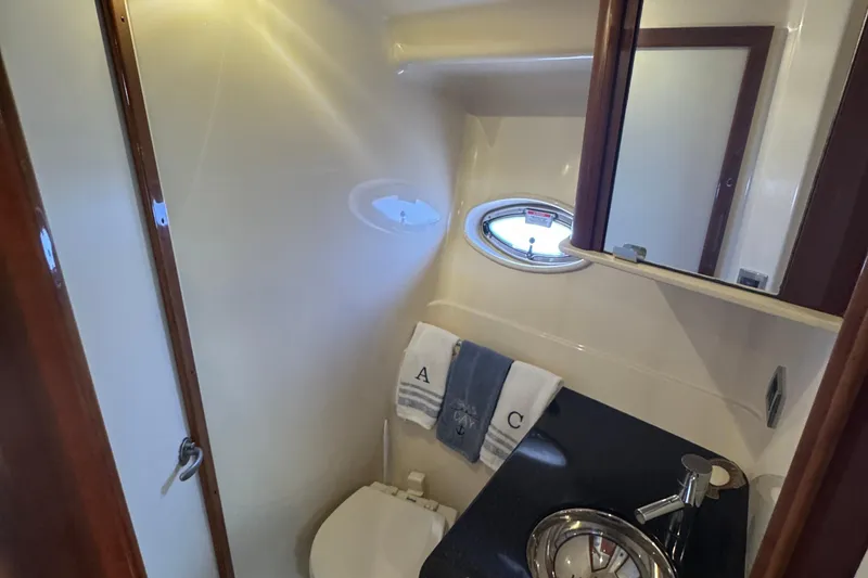 Slide: The Image of Bathroom interior of 2010 Sea Ray 390 Sundancer yacht with sink and porthole. - 37
