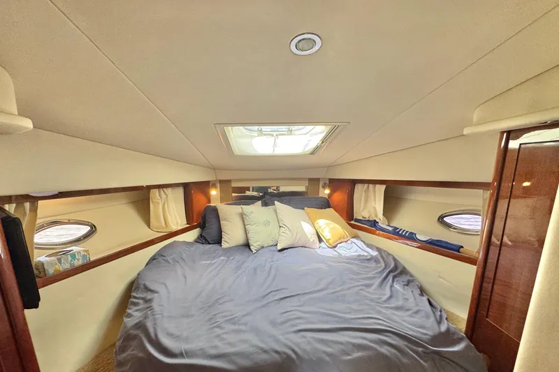 Slide: The Image of Luxurious cabin interior of 2010 Sea Ray 390 Sundancer yacht with cozy bedding. - 40