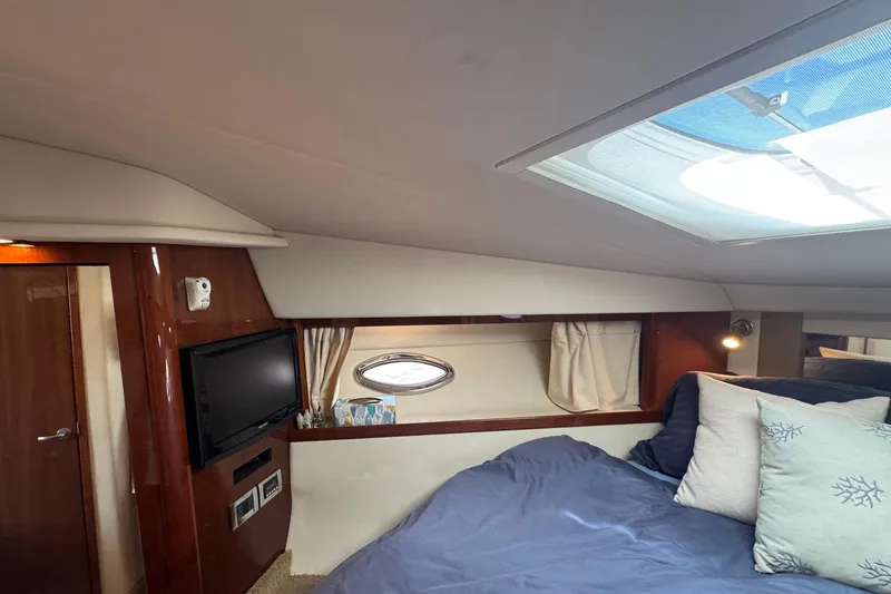 Slide: The Image of Interior of 2010 Sea Ray 390 Sundancer yacht with cozy bed and TV. - 41