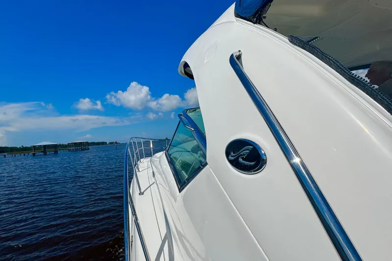 Slide: The Image of 2010 Sea Ray 390 Sundancer yacht cruising on a sunny day with blue skies. - 5