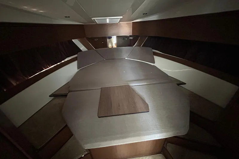 Slide: The Image of Interior cabin of 2022 Beneteau Antares 11, featuring a cozy sleeping area. - 15