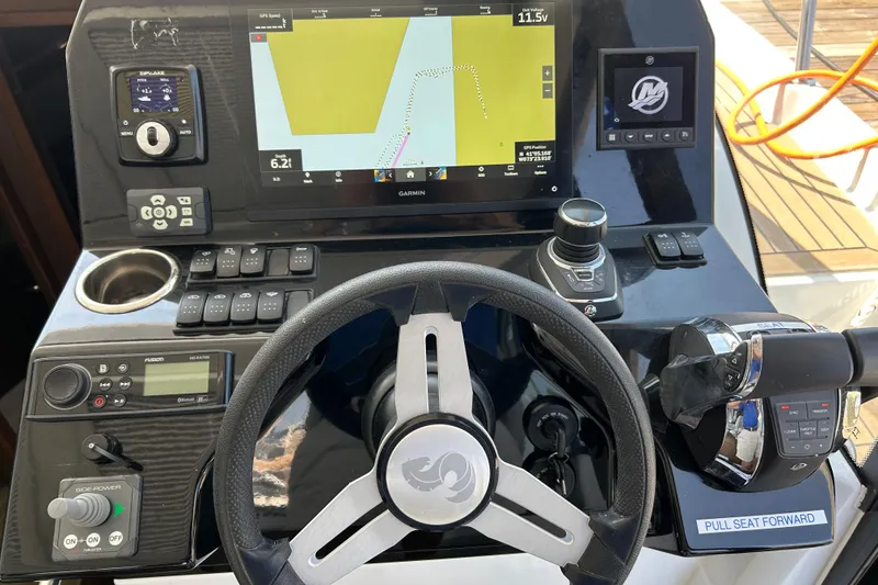 Slide: The Image of Helm of 2022 Beneteau Antares 11 with navigation controls and display screen. - 18
